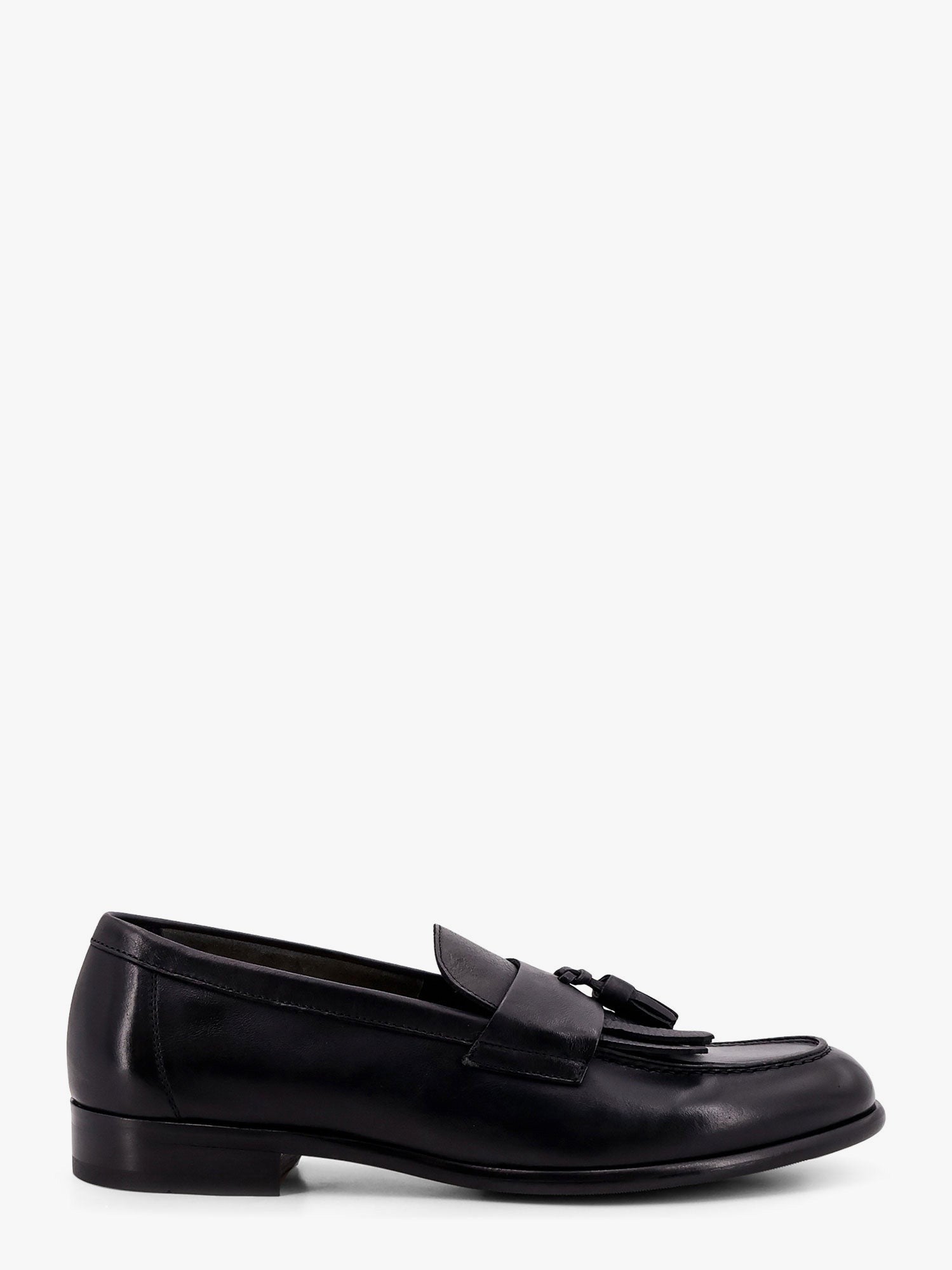 Mocassin en cuir avec pompons emblématiques