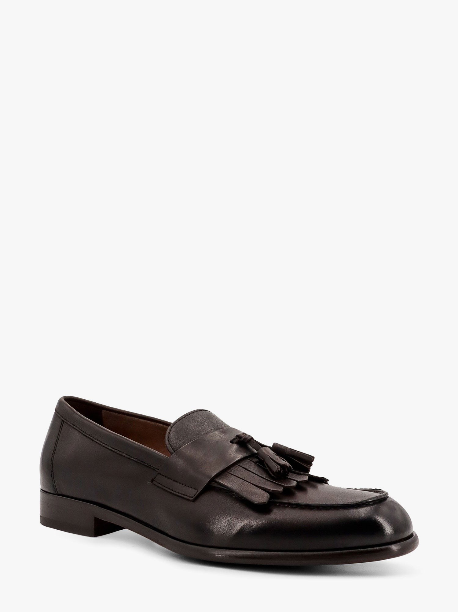 Mocassin en cuir avec pompons emblématiques
