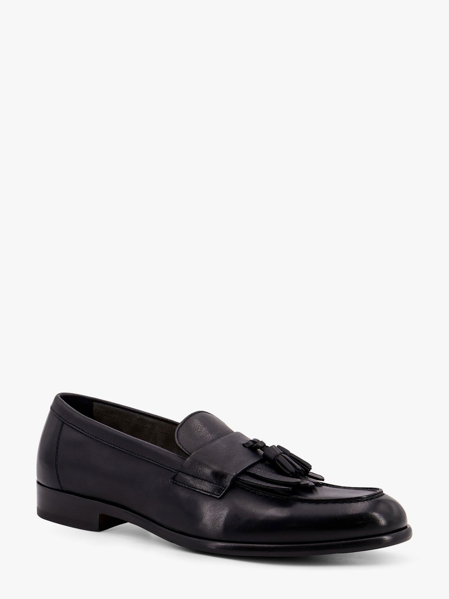 Mocassin en cuir avec pompons emblématiques