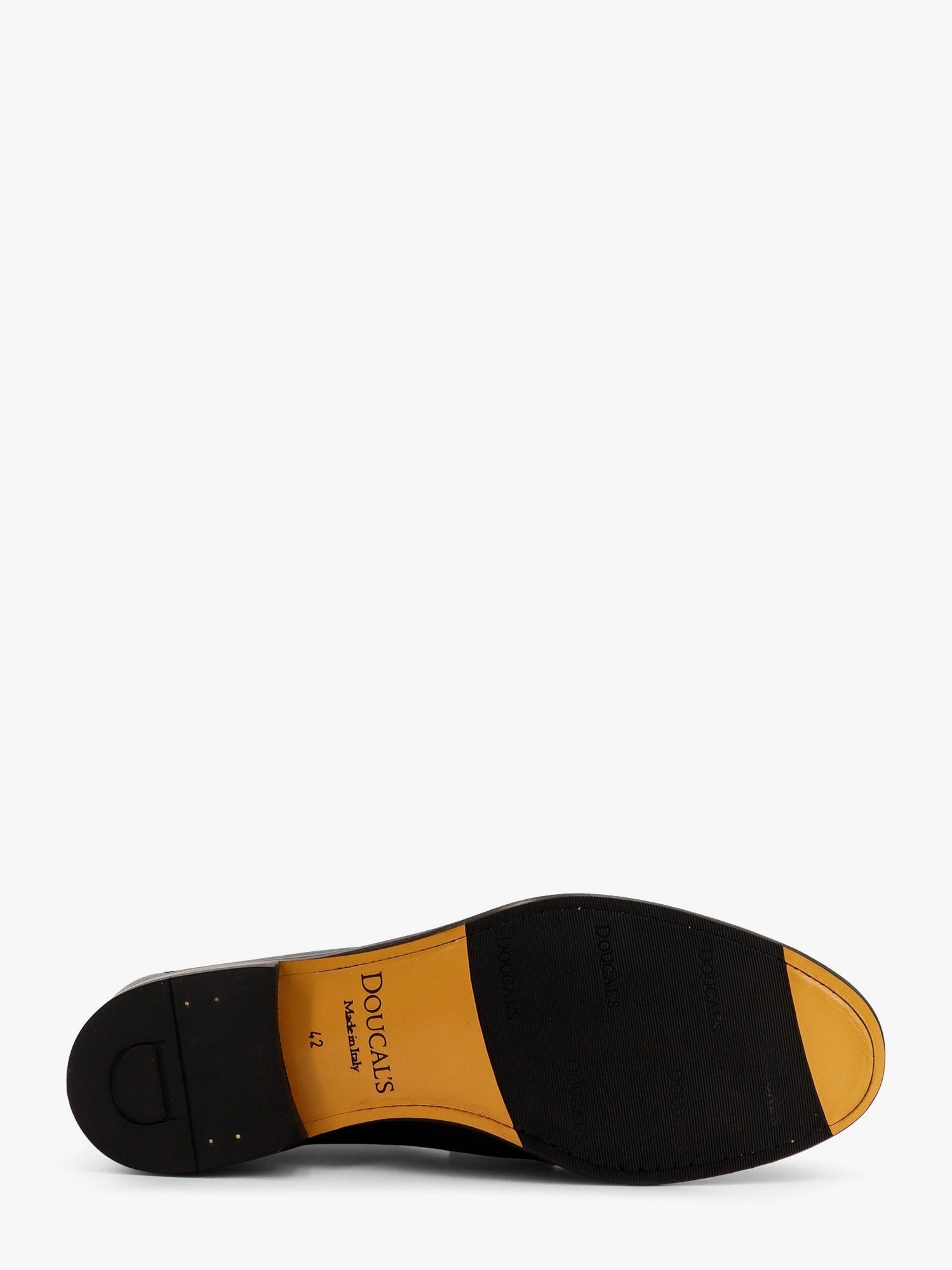Mocassin en cuir avec pompons emblématiques