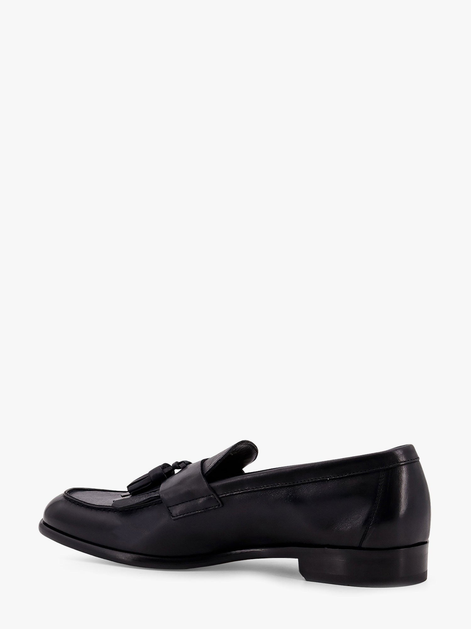 Mocassin en cuir avec pompons emblématiques