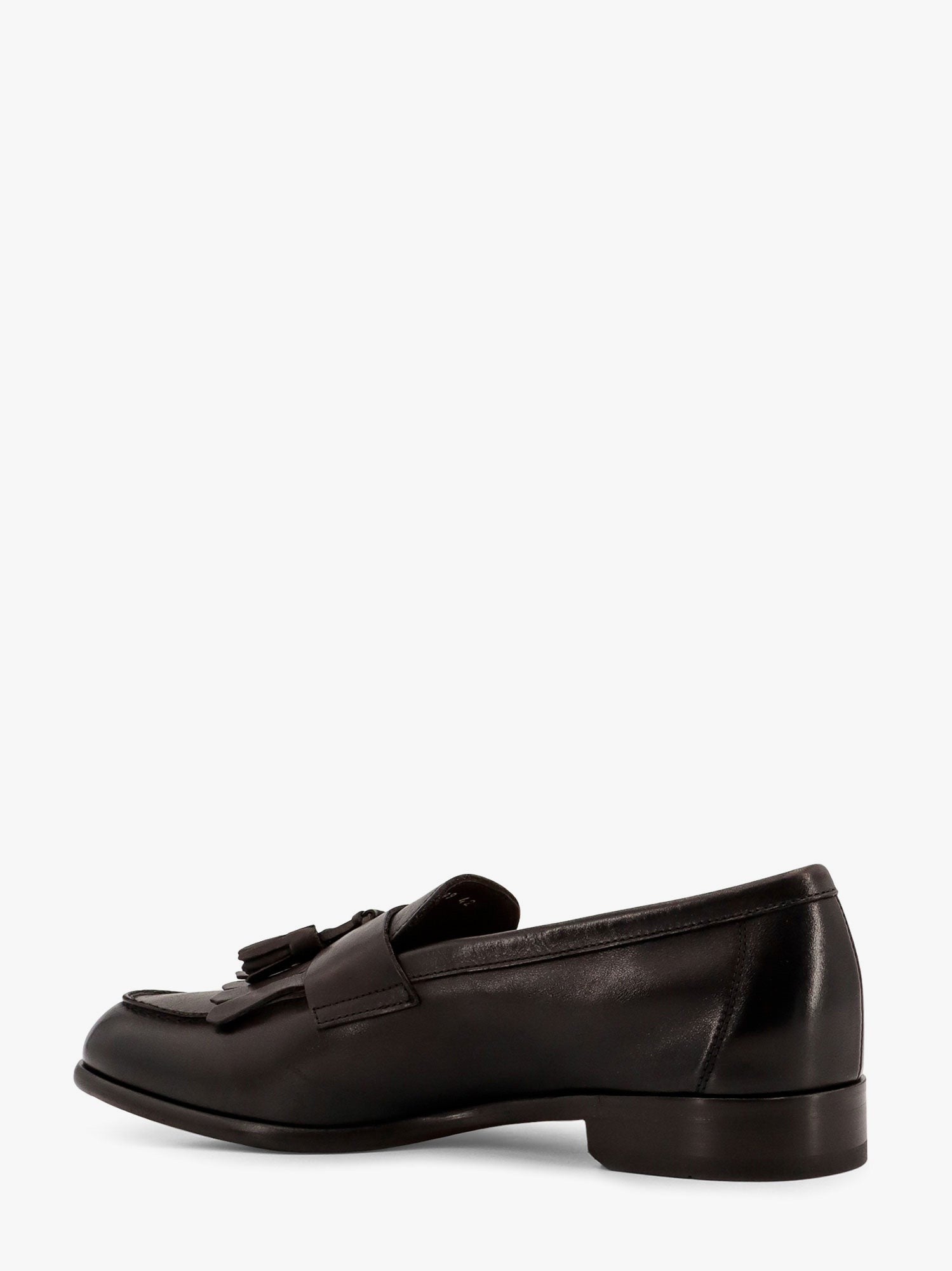 Mocassin en cuir avec pompons emblématiques